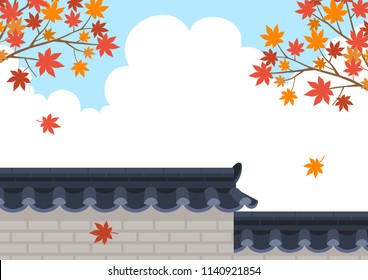 Traditional Korean style stone wall fence with maple tree on sky background.Mid Autumn Festival(chuseok)