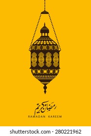 traditional lantern of Ramadan- Ramadan Kareem beautiful greeting card with arabic calligraphy which means ''Ramadan kareem '' .