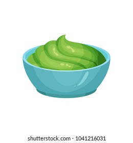 Traditional Mexican guacamole in blue ceramic dip bowl. Dishes component. Cooking ingredient. Organic food. Flat vector element for restaurant or cafe menu