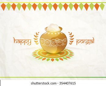 Traditional mud pot, full of rice on rangoli for South Indian harvesting festival, Happy Pongal celebration.