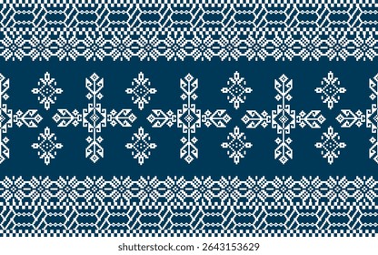 Traditional Nordic knitting pattern featuring symmetrical geometric shapes in white on a dark blue background.