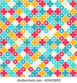 Traditional quatrefoil lattice pattern. Colorful quatrefoil shapes, bright colors - red, turquoise, yellow. Seamless vector background.