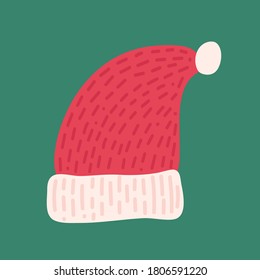 Traditional red Santa Hat. Funny holiday clothes. Traditional element isolated on green background
