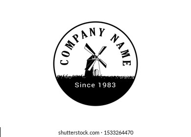 traditional rural windmill. Bakery logo or label. Vintage vector illustration