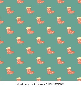 Traditional seamless pattern with winter gift sock silhouettes. Blue pastel background. Flat vector print for textile, fabric, gift wrap, wallpapers. Endless illustration.