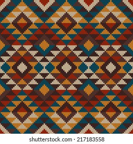 Traditional Tribal Aztec seamless pattern on the wool knitted texture