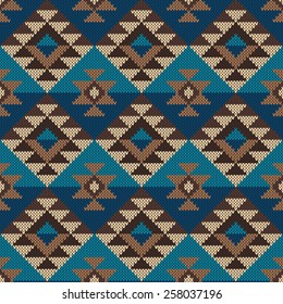 Traditional Tribal Aztec seamless pattern on the wool knitted texture