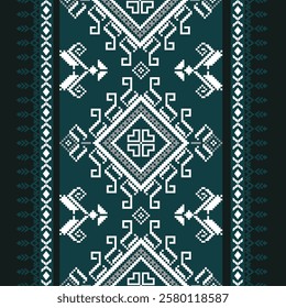 traditional Ukrainian cross-stitch pattern with geometric floral patterns resembling pixels in shades of white, teal and grey.traditional pattern often used to decorate clothing, bedding and textiles.