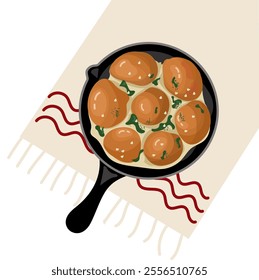 Traditional Ukrainian cuisine. Baked balls with garlic and herbs (pampushky) served in a small frying pan.