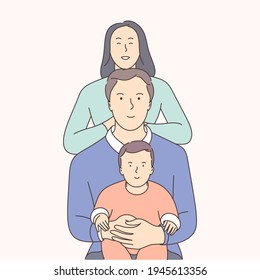 Traditional values, bonding, family idyll concept. Happy man, a woman and children stand side by side and hug each other.