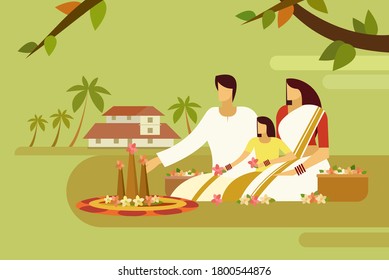 Traditionally dressed family do floral designs on floor against the background of their home. Concept of Onam festival in Kerala