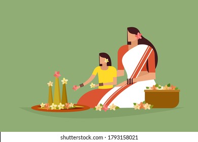 Traditionally dressed mother and daughter do floral designs on floor. Concept of Onam festival in Kerala.