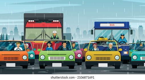 The traffic in the city is constantly jammed while it rains.