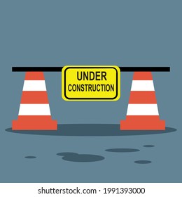Traffic cone with under construction sign board