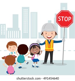 Traffic Guard Helping Kids Crossing Road By Holding A Stop Sign