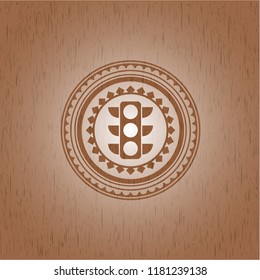 traffic light icon inside badge with wooden background