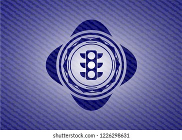 traffic light icon inside badge with denim texture