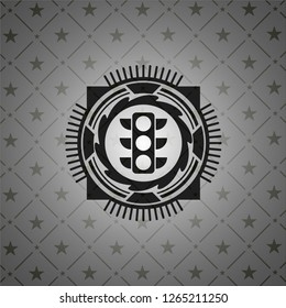 traffic light icon inside black emblem