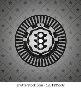 traffic light icon inside black emblem
