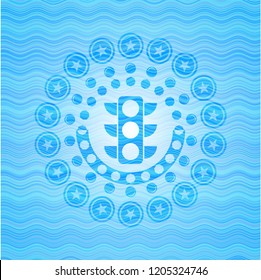 traffic light icon inside light blue water emblem.