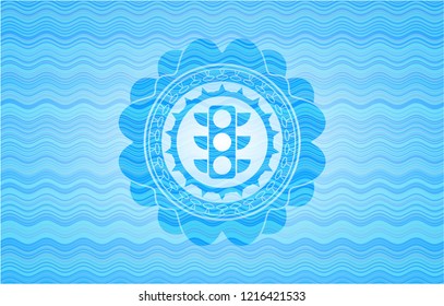traffic light icon inside light blue water badge background.