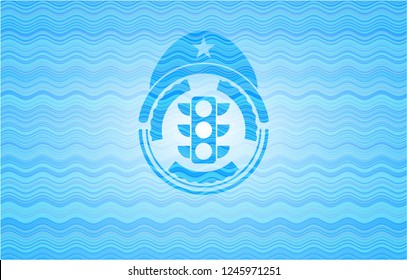 traffic light icon inside light blue water emblem background.