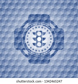 traffic light icon inside blue emblem with geometric pattern background.
