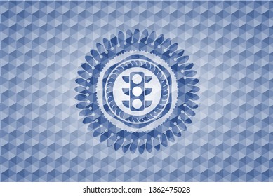 traffic light icon inside blue polygonal emblem.