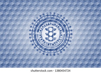 traffic light icon inside blue badge with geometric pattern.