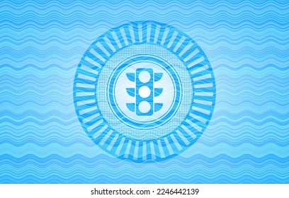 traffic light icon inside light blue water style emblem. 