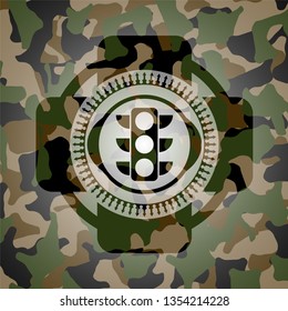 traffic light icon inside camouflage emblem