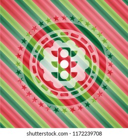 traffic light icon inside christmas colors badge.