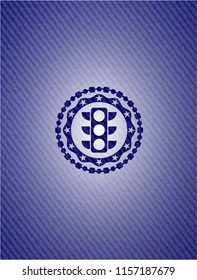 traffic light icon inside emblem with denim texture