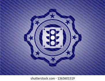 traffic light icon inside emblem with denim texture