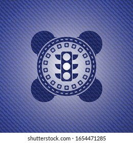icono del semáforo dentro del emblema con fondo de jean
