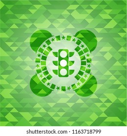 traffic light icon inside green emblem with mosaic background