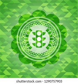 traffic light icon inside green emblem with mosaic ecological style background