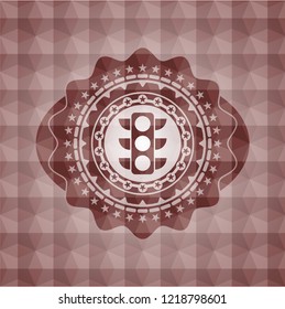 traffic light icon inside red seamless badge with geometric pattern background.