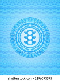 traffic light icon inside sky blue water emblem background.