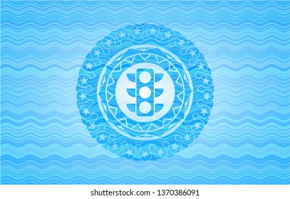 traffic light icon inside sky blue water emblem.