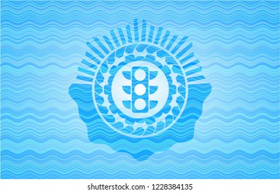 traffic light icon inside water concept emblem.