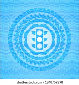 traffic light icon inside water concept badge background.