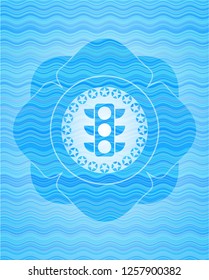 traffic light icon inside water representation emblem.