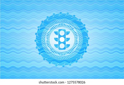 traffic light icon inside water wave concept badge.