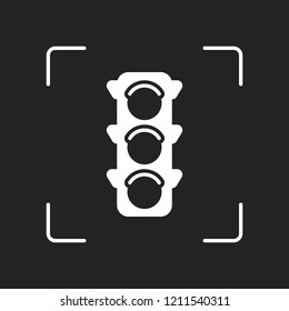 Traffic light icon. White object in camera autofocus on dark background