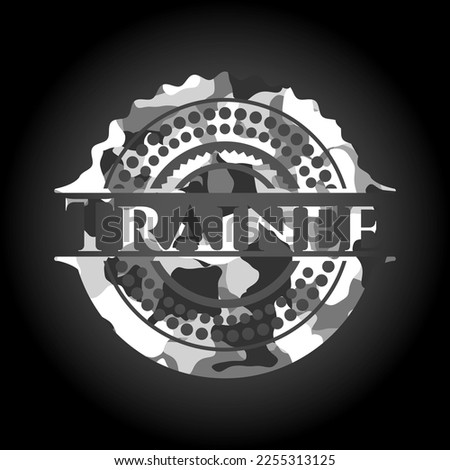 Trainee written on a grey camouflage texture 