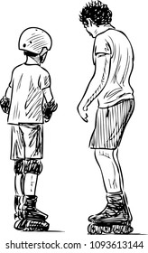 A trainer teaches a boy to skate on rollers