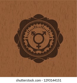 transgender icon inside badge with wooden background