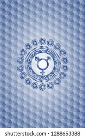 transgender icon inside blue emblem or badge with geometric pattern background.