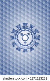 transgender icon inside blue hexagon emblem.